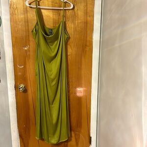 Brand new 100% polyester. Green silky dress